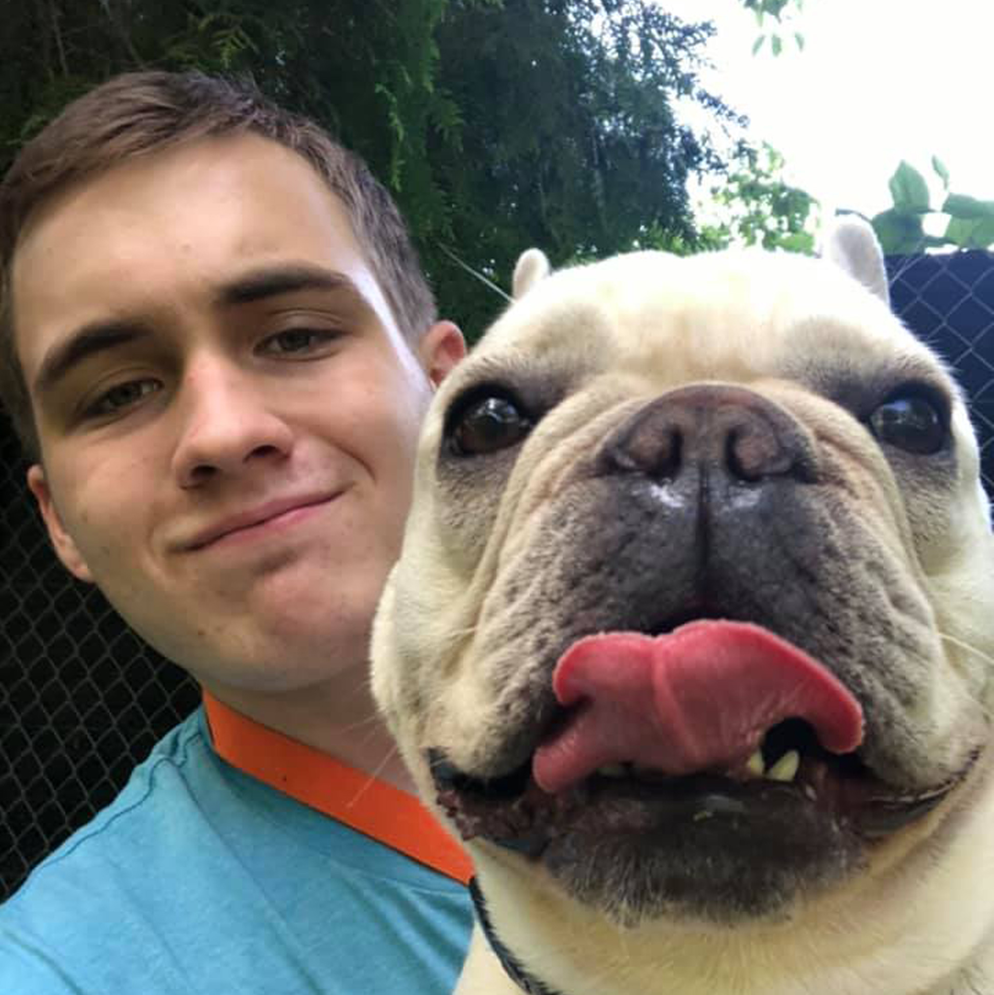 Tyler McKendree holding a dog